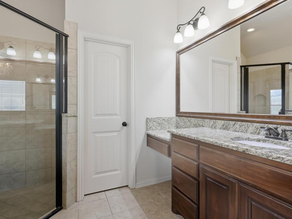 206 Brighton Court Midlothian, TX 76065 - Photo 14 of 15 a bathroom with a granite countertop sink a mirror and a