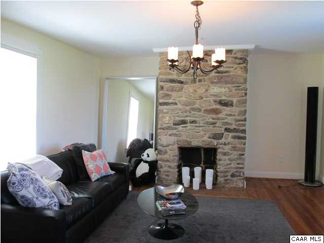 5585 Stony Point Road Barboursville, VA 22923 - Photo 3 of 28 a living room with furniture and a fireplace