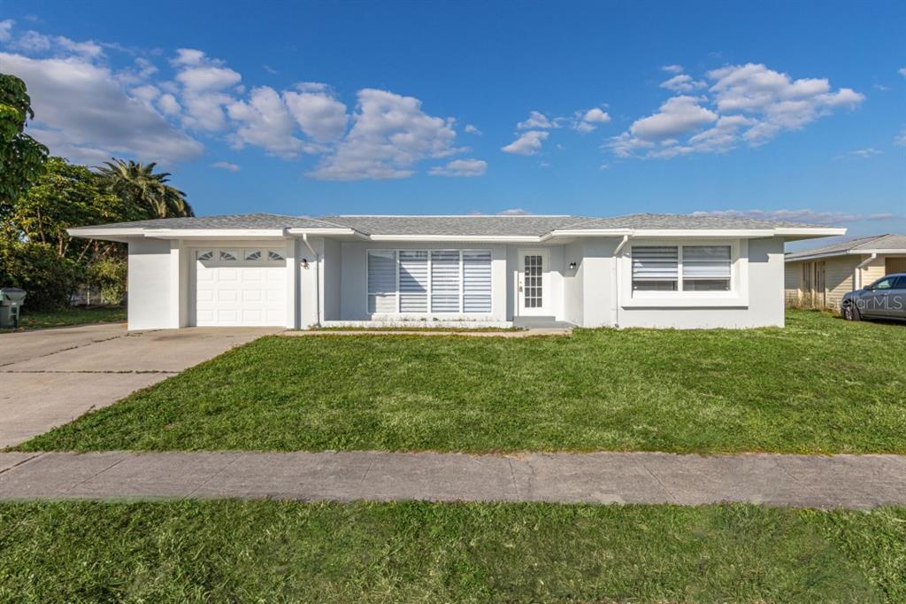 6422 Fabian Road North Port, FL 34287 - Photo 1 of 1 a front view of a house with a garden