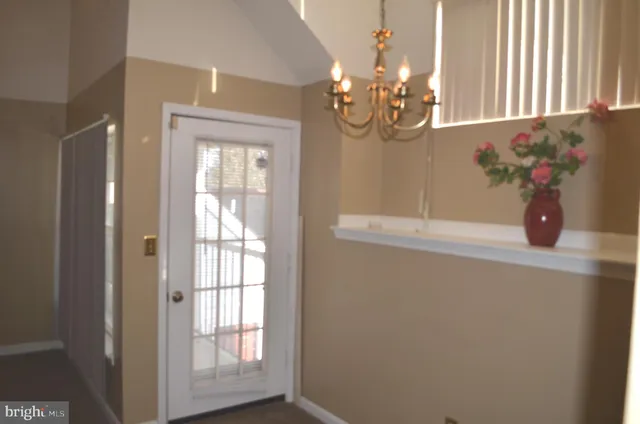 a room with a window and a chair