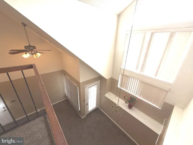 a view of staircase and living room