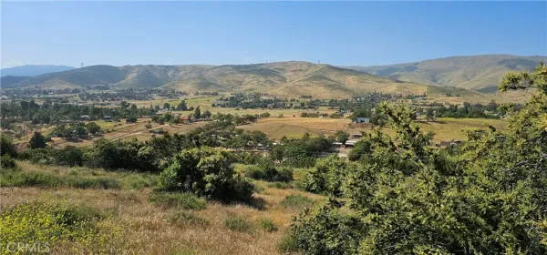 a view of a town with mountains in the background