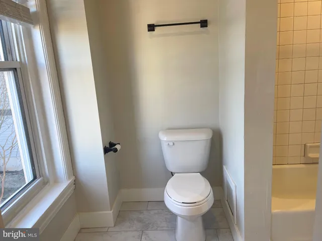 a bathroom with a bathtub and a sink