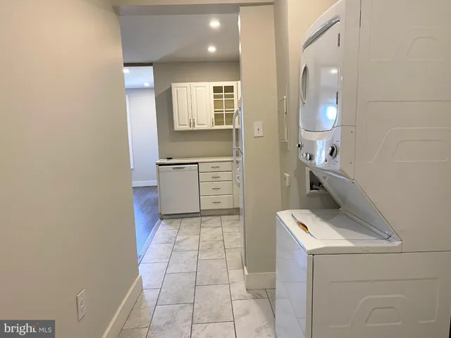 a kitchen with a stove and a refrigerator