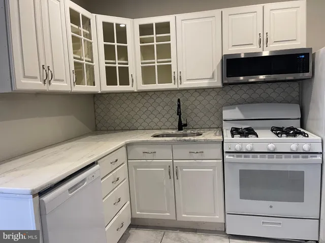 a kitchen with a sink and a window