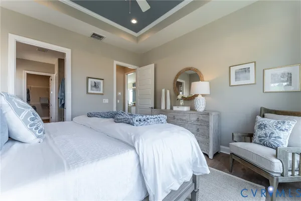 a spacious bedroom with a bed and a couch