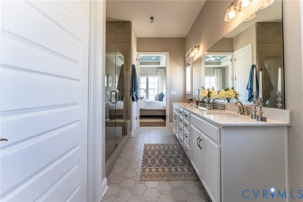 a bathroom with a double vanity sink and a mirror