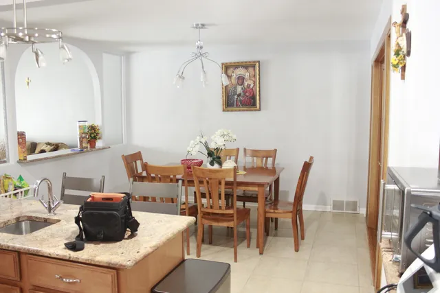 a dining room with furniture and window