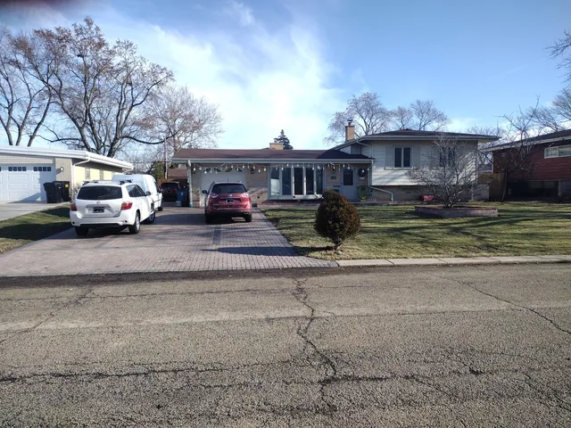 a car parked in front of a house