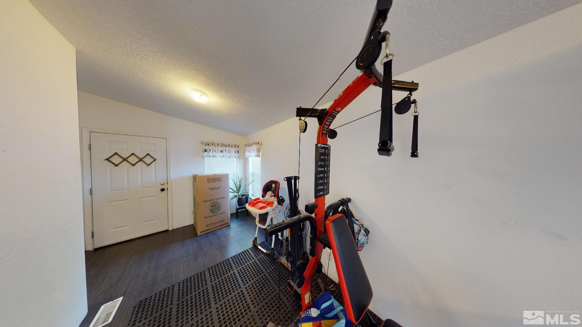 230 Danforth Drive Sun Valley, NV 89433 - Photo 14 of 28 a view of a room with gym equipment