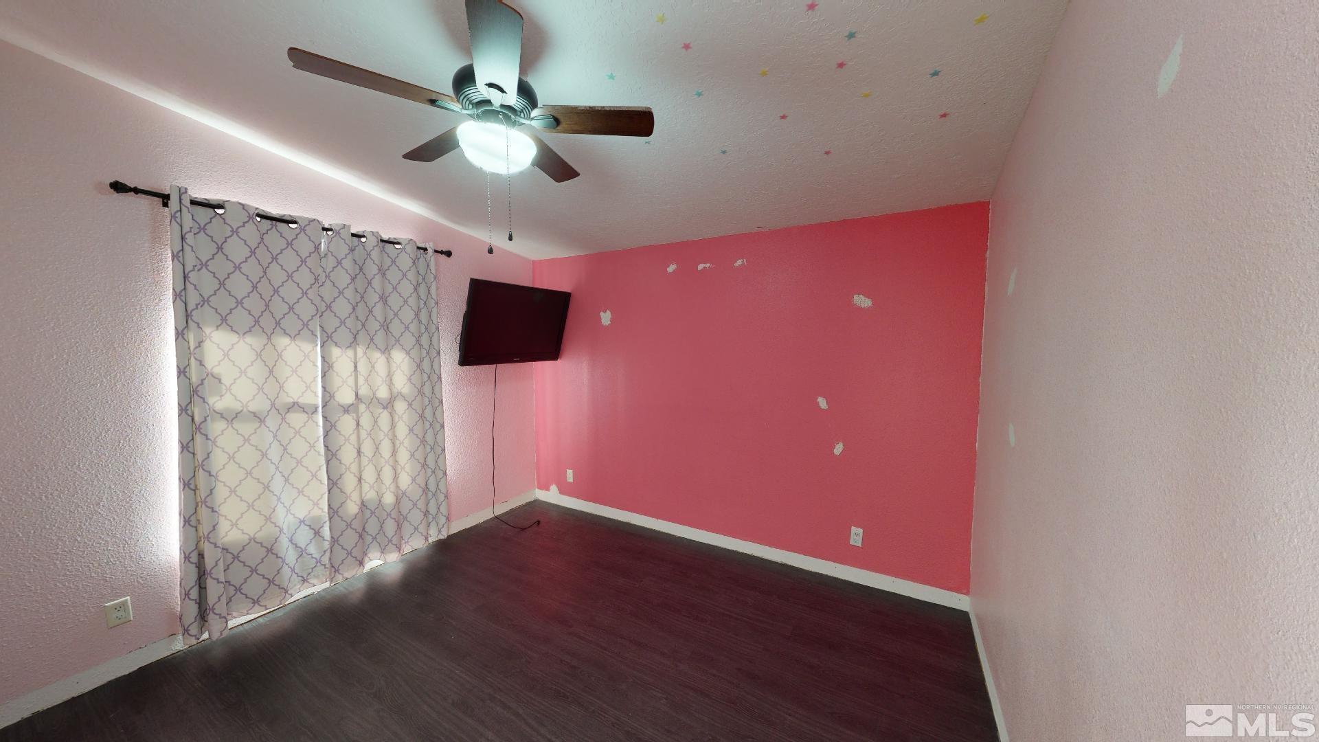 230 Danforth Drive Sun Valley, NV 89433 - Photo 18 of 28 a view of an empty room with a window