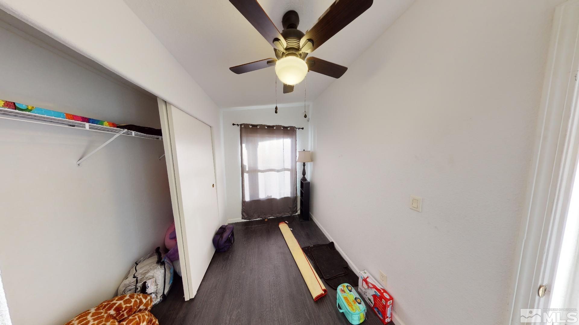 230 Danforth Drive Sun Valley, NV 89433 - Photo 20 of 28 a very nice looking room with a ceiling fan and a window