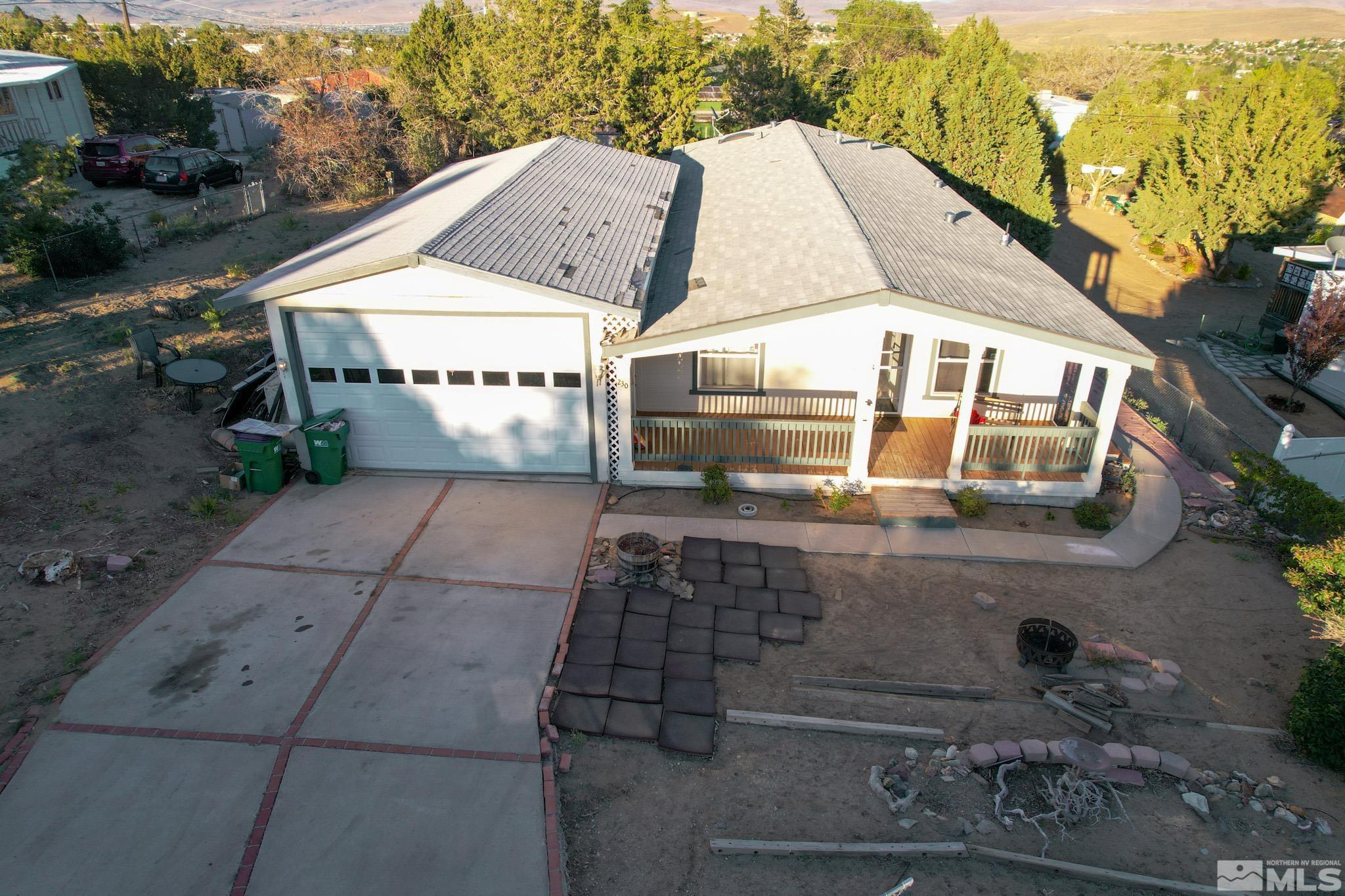 230 Danforth Drive Sun Valley, NV 89433 - Photo 3 of 28 a view of a white house with a yard