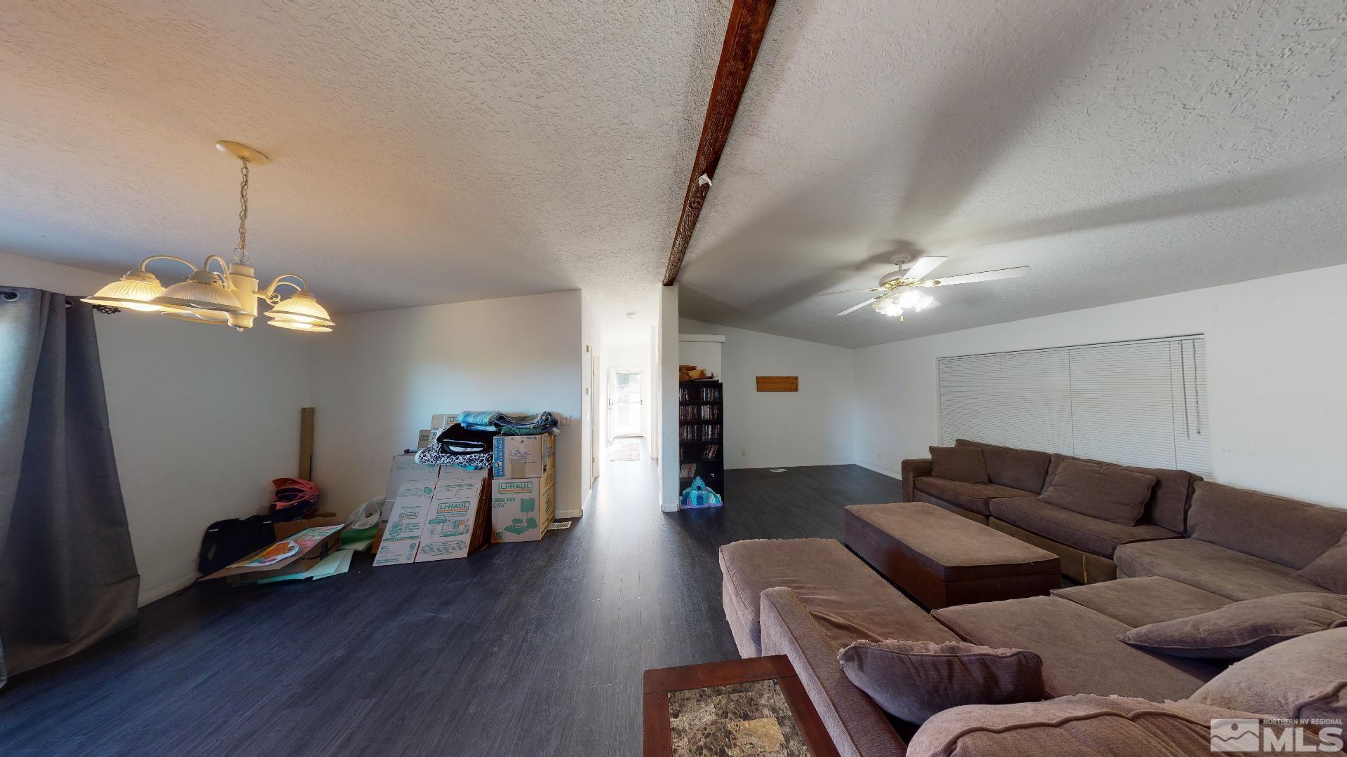 230 Danforth Drive Sun Valley, NV 89433 - Photo 7 of 28 a living room with furniture or kitchen and a chandelier