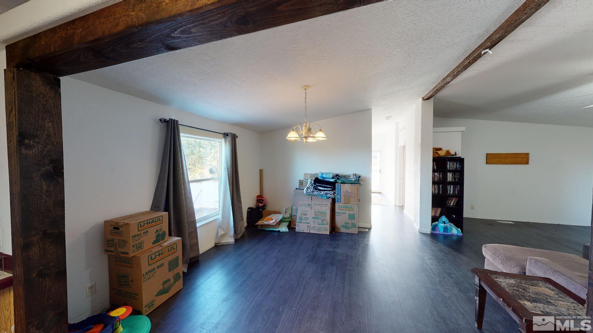 230 Danforth Drive Sun Valley, NV 89433 - Photo 10 of 28 a view of a livingroom with furniture and wooden floor