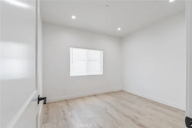 an empty room with a empty space and a window