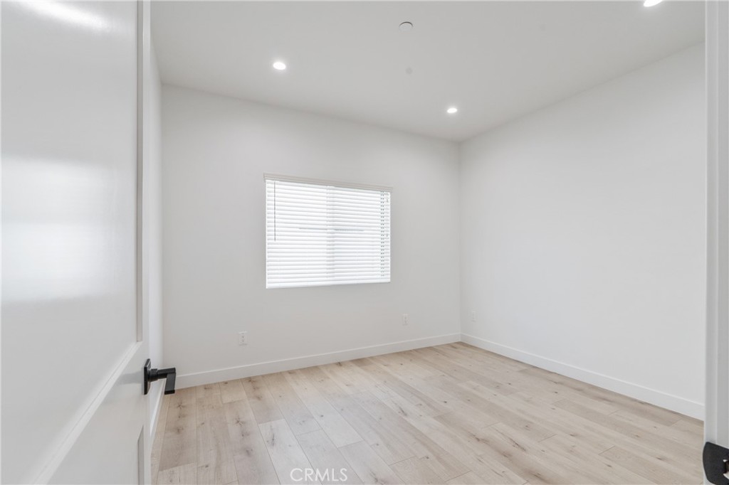 11142 Woodley Avenue Granada Hills, CA 91344 - Photo 4 of 11 an empty room with a empty space and a window