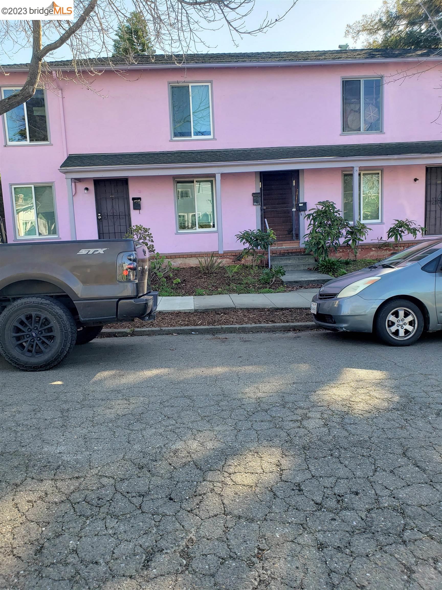 a front view of a house with parking space