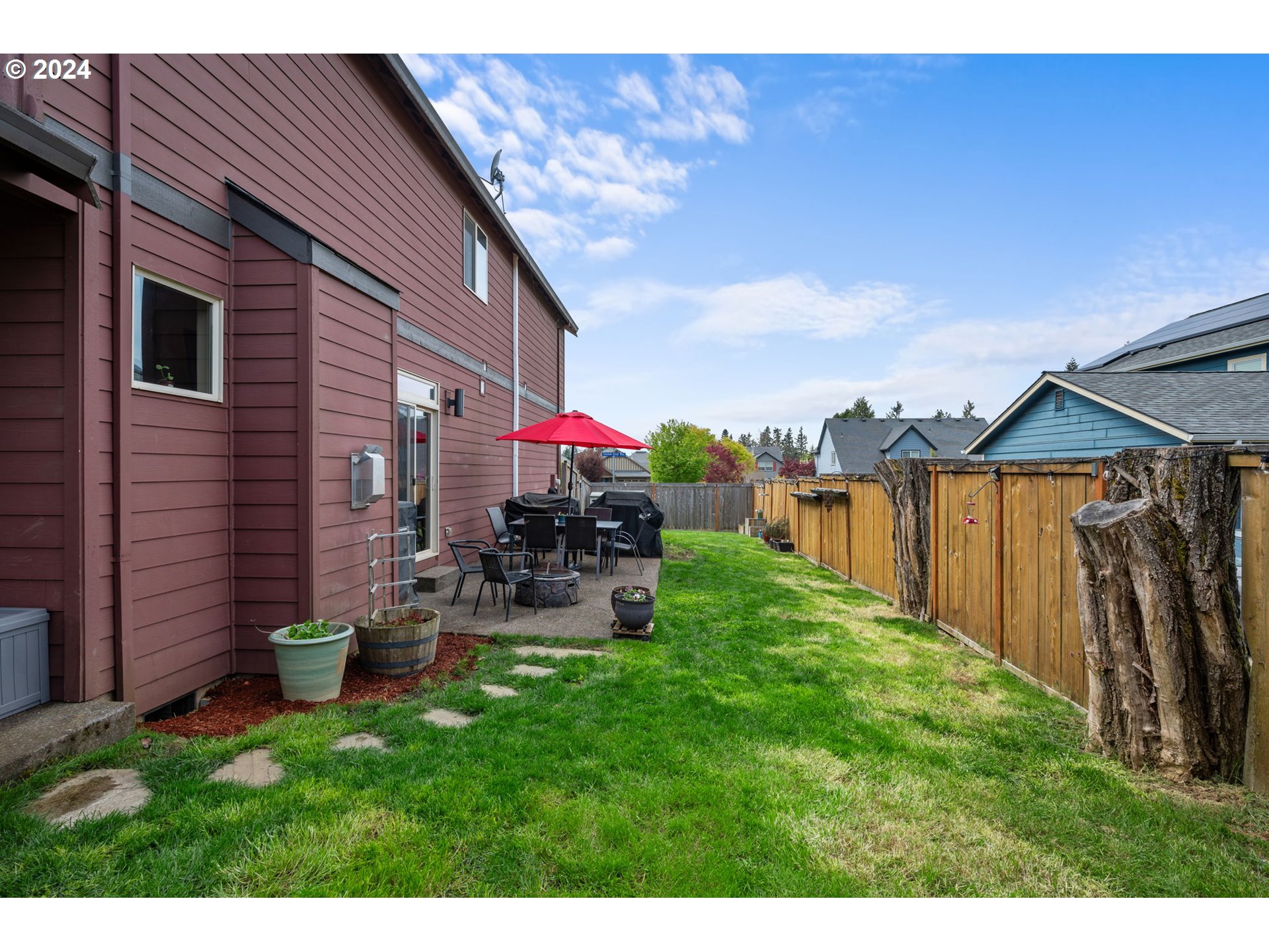 18438 Shadow Ridge Way Oregon City, OR 97045 - Photo 29 of 38 a view of a chair and tables in the backyard of the house