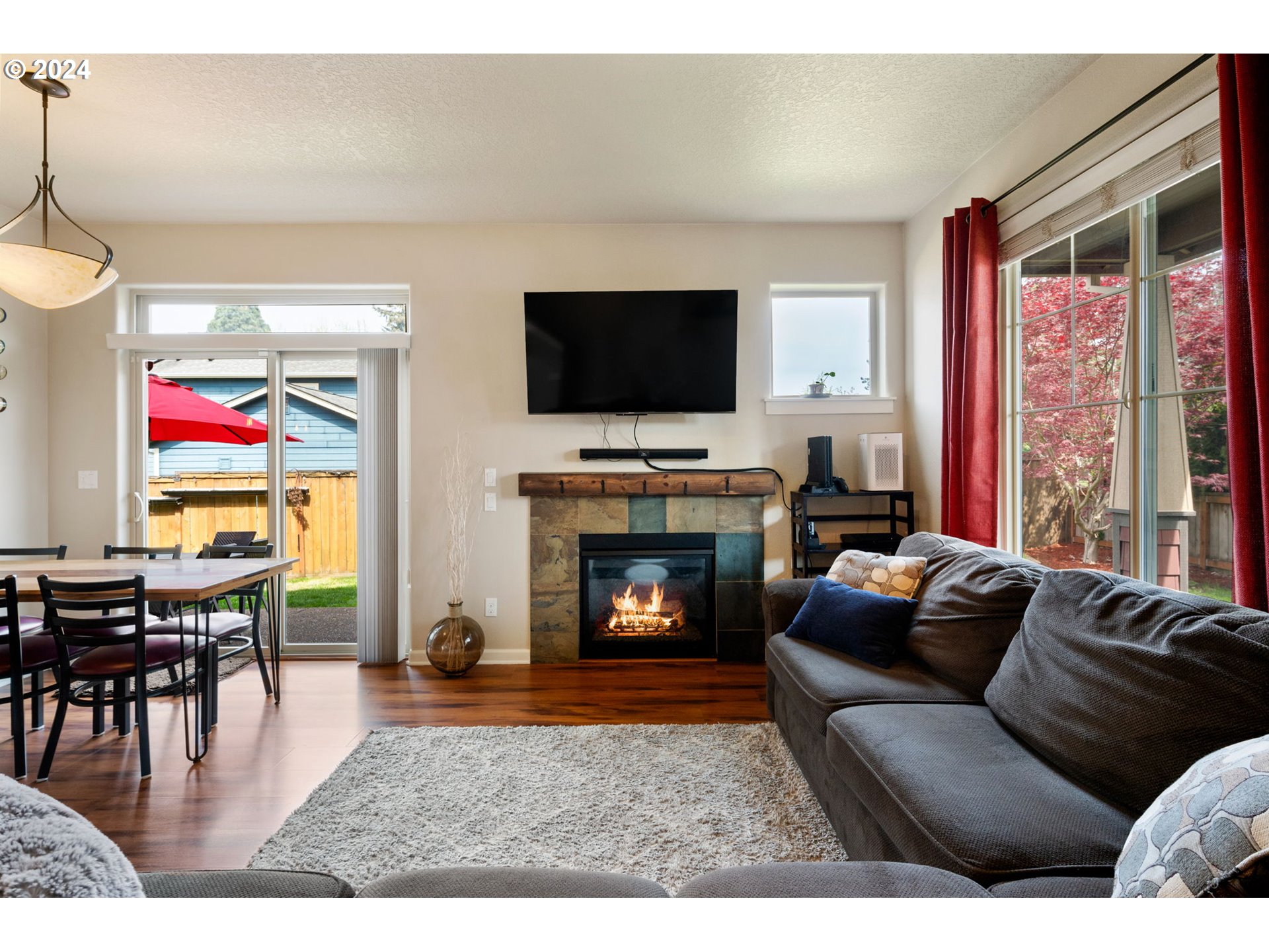 18438 Shadow Ridge Way Oregon City, OR 97045 - Photo 6 of 38 a living room with furniture fireplace and flat screen tv