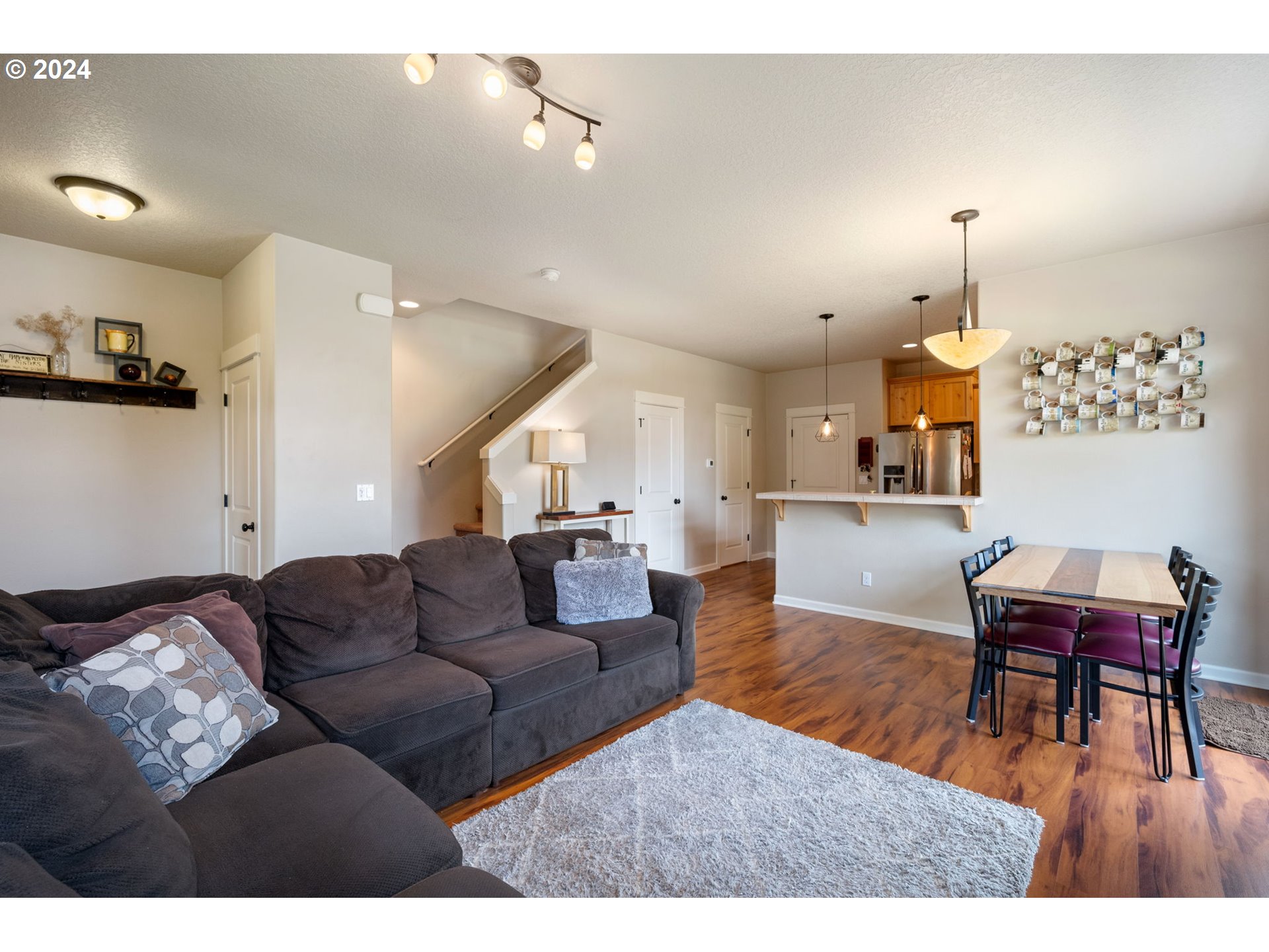 18438 Shadow Ridge Way Oregon City, OR 97045 - Photo 8 of 38 a living room with furniture and wooden floor