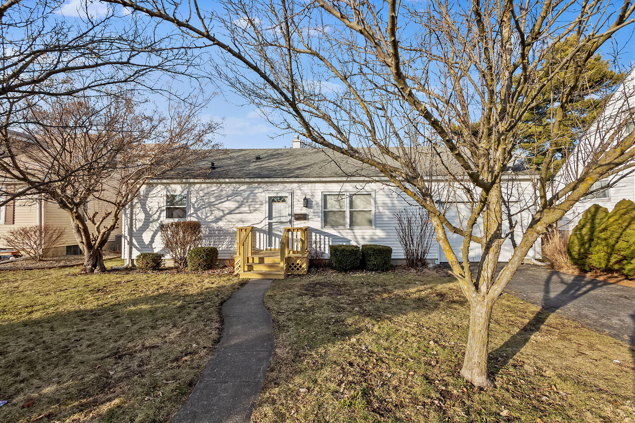 a view of a yard with a house and a trees