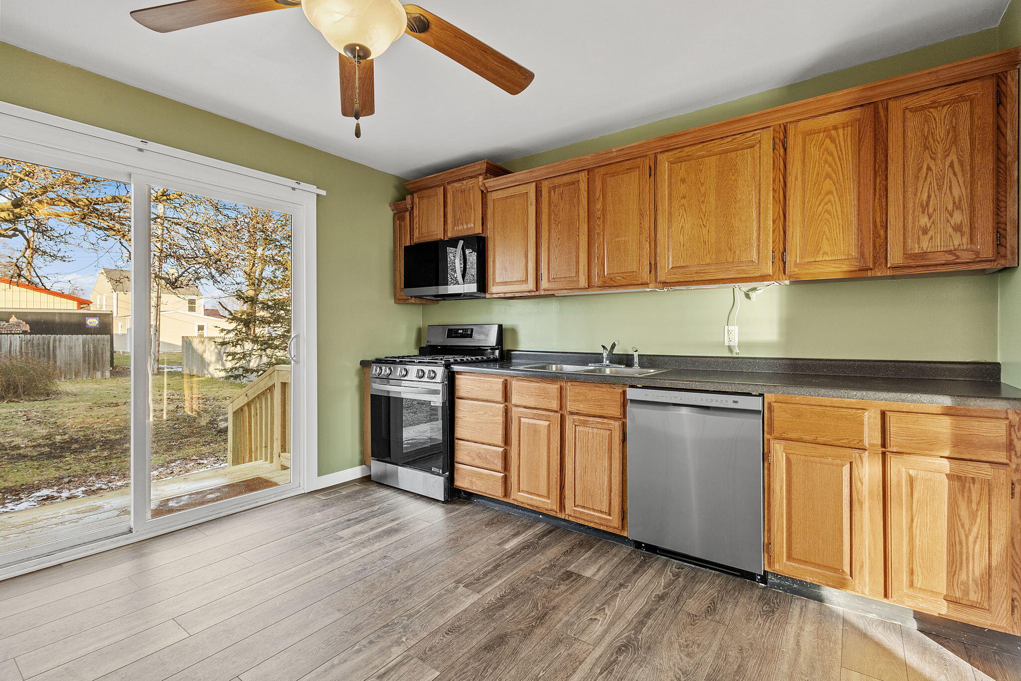 522 West Parks Drive Rensselaer, IN 47978 - Photo 11 of 29 a kitchen with stainless steel appliances granite countertop a stove a sink and a refrigerator