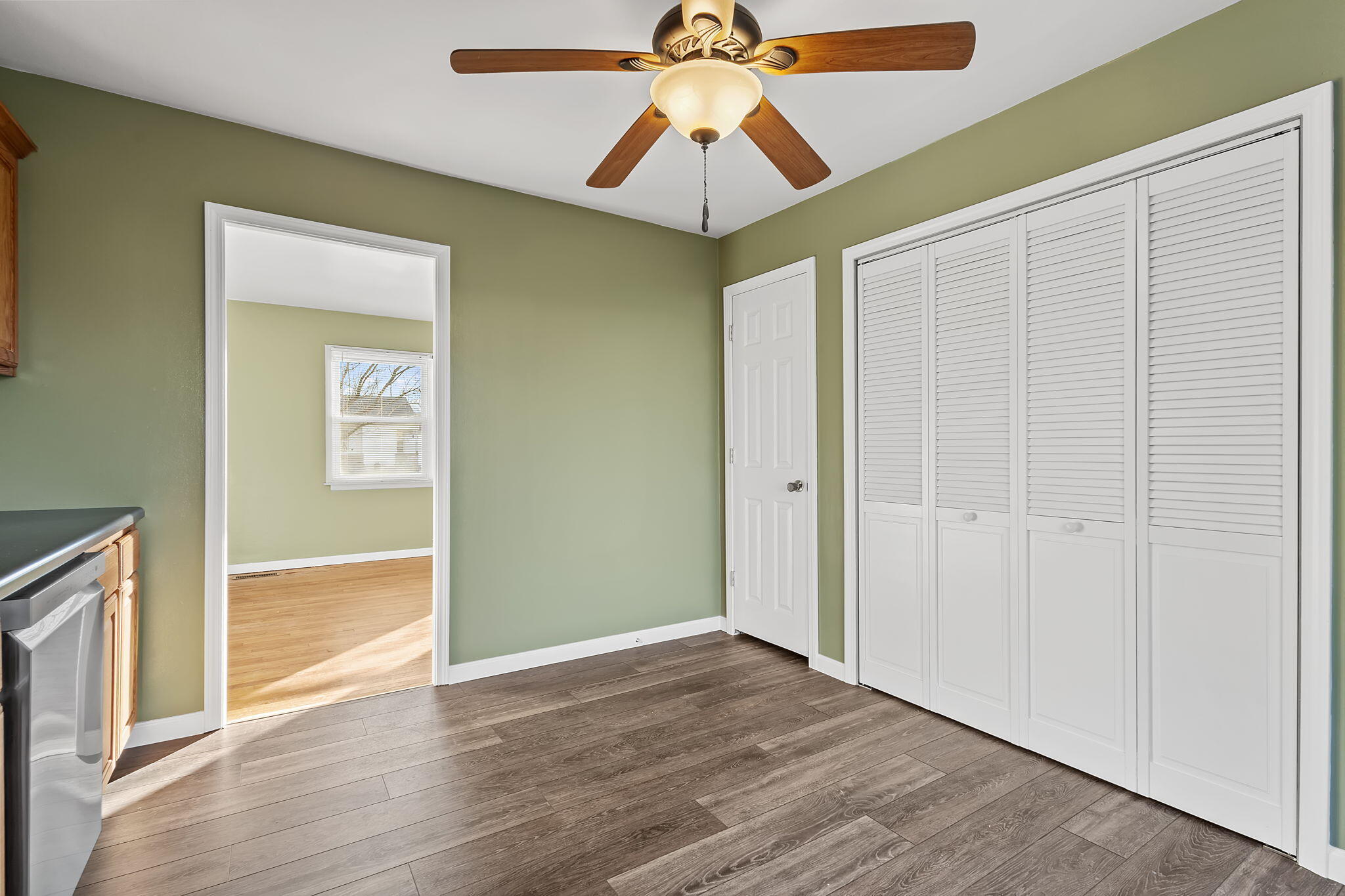 522 West Parks Drive Rensselaer, IN 47978 - Photo 13 of 29 an empty room with wooden floor fan and windows