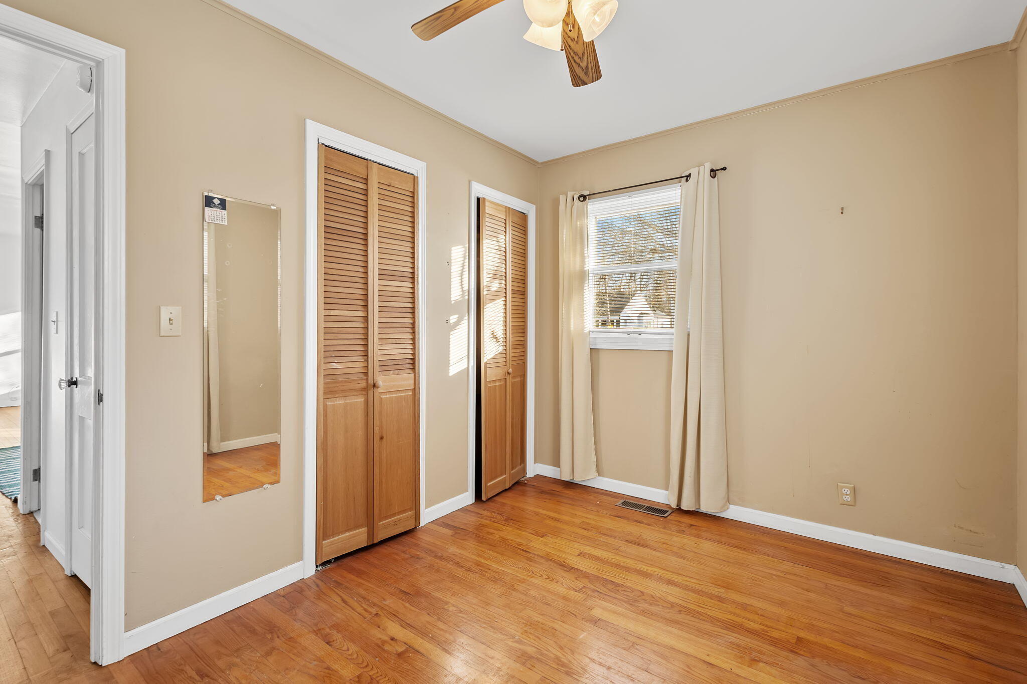 522 West Parks Drive Rensselaer, IN 47978 - Photo 18 of 29 a view of an empty room with wooden floor and a window