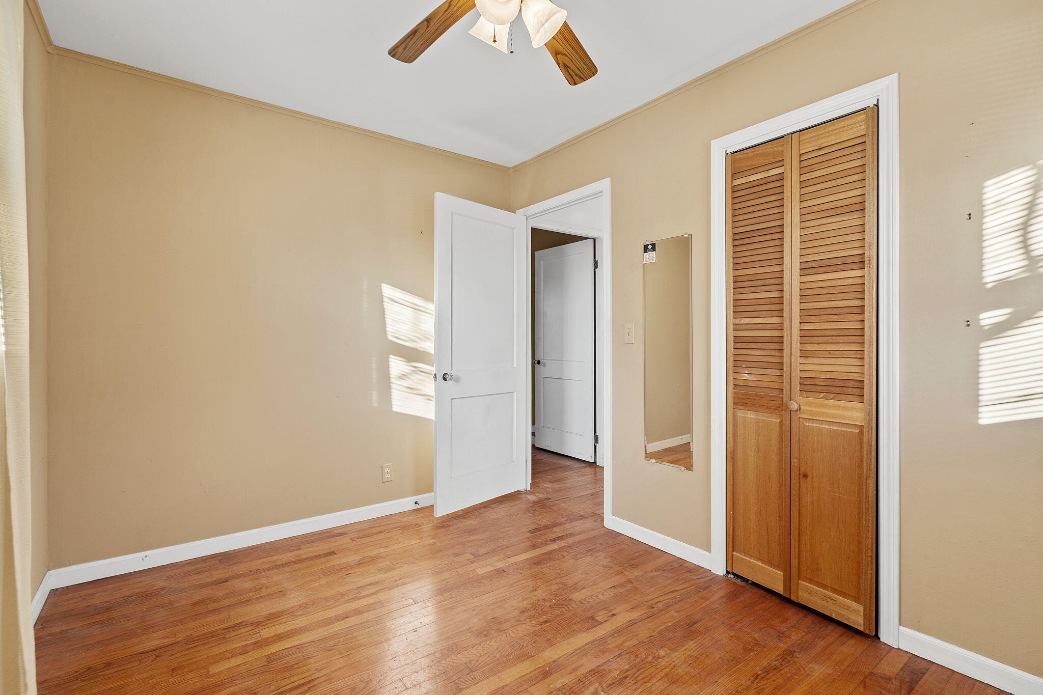 522 West Parks Drive Rensselaer, IN 47978 - Photo 19 of 29 an empty room with wooden floor and windows