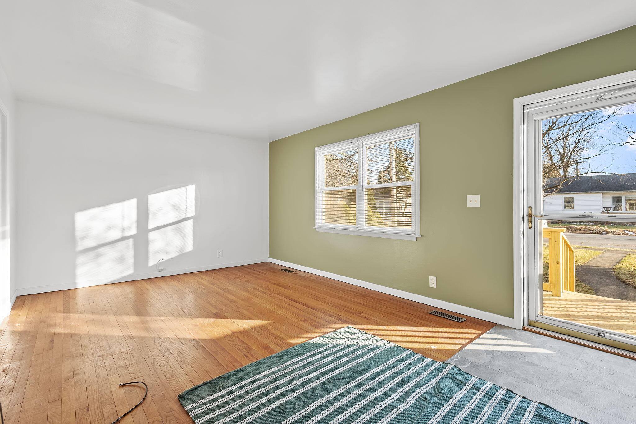 522 West Parks Drive Rensselaer, IN 47978 - Photo 6 of 29 a view of a room with wooden floor and windows
