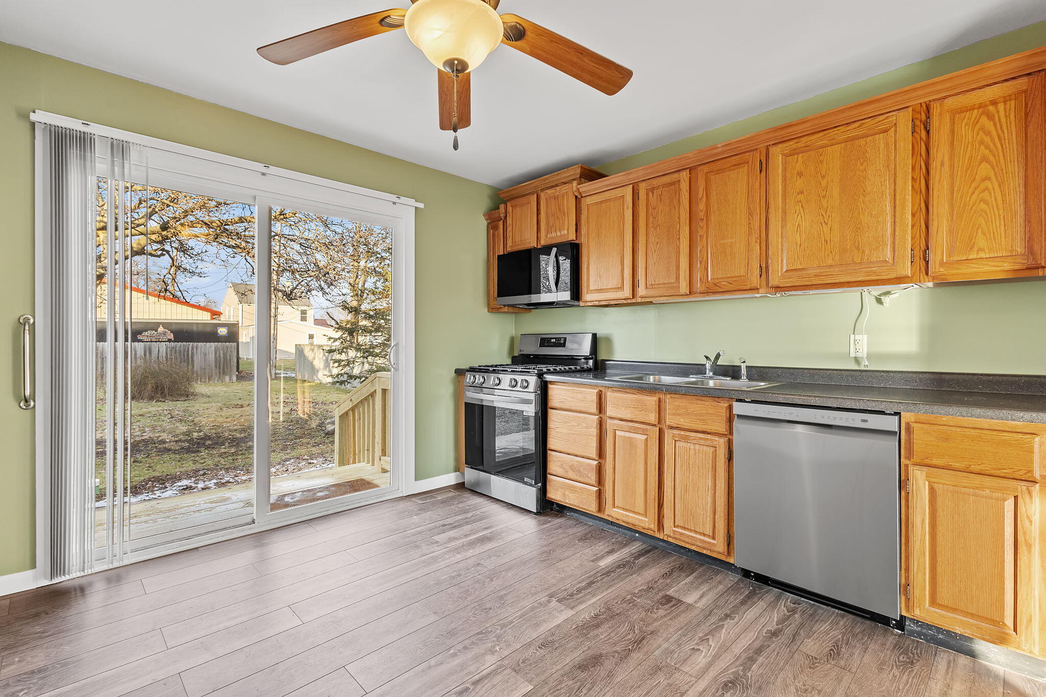 522 West Parks Drive Rensselaer, IN 47978 - Photo 10 of 29 a kitchen with stainless steel appliances granite countertop a stove a sink and a refrigerator