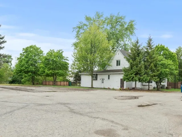 a house with a tree in front of it