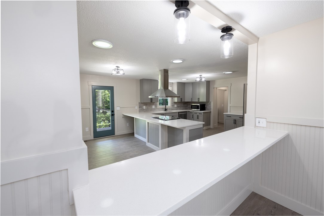 104 Coolview Drive Seneca, SC 29672 - Photo 18 of 50 Bar counter from dining room to kitchen