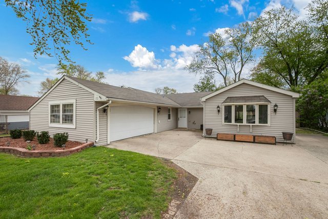 172 Oxford Road Bolingbrook, IL 60440 - Photo 1 of 27 a view of a house with a yard and large tree