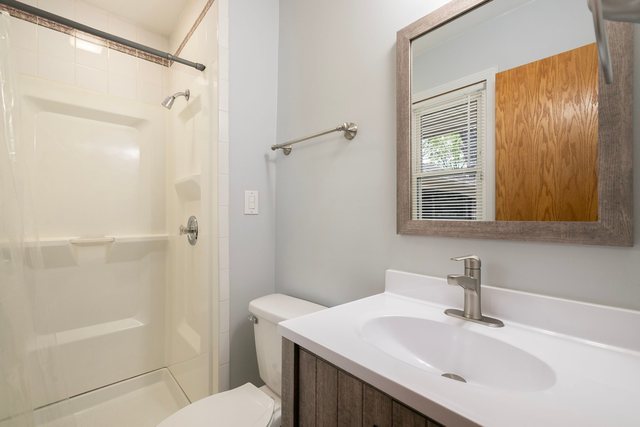 172 Oxford Road Bolingbrook, IL 60440 - Photo 14 of 27 a bathroom with a sink toilet and shower