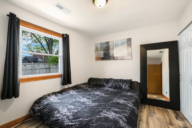 172 Oxford Road Bolingbrook, IL 60440 - Photo 15 of 27 a bedroom with a bed and a window