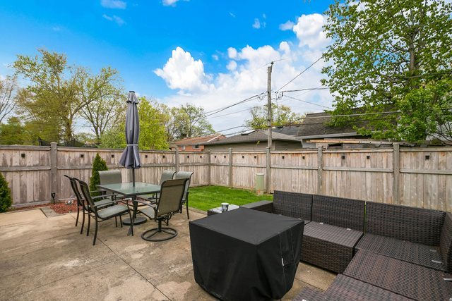 172 Oxford Road Bolingbrook, IL 60440 - Photo 20 of 27 a view of a patio with table and chairs and potted plants
