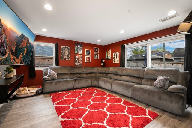 172 Oxford Road Bolingbrook, IL 60440 - Photo 2 of 27 a living room with furniture and a flat screen tv