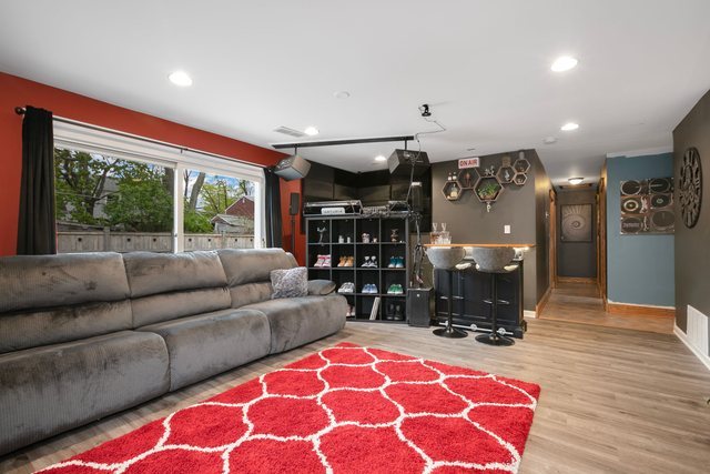 172 Oxford Road Bolingbrook, IL 60440 - Photo 3 of 27 a living room with furniture a dining table and a fireplace