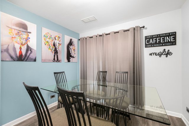 172 Oxford Road Bolingbrook, IL 60440 - Photo 10 of 27 a view of a hallway with paintings on the wall