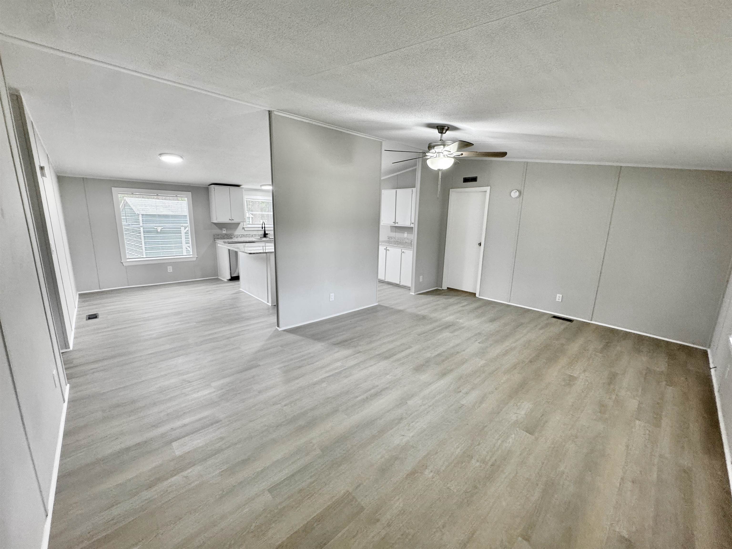 3178 Portersville Road Atoka, TN 38004 - Photo 13 of 31 wooden floor in an empty room with a window