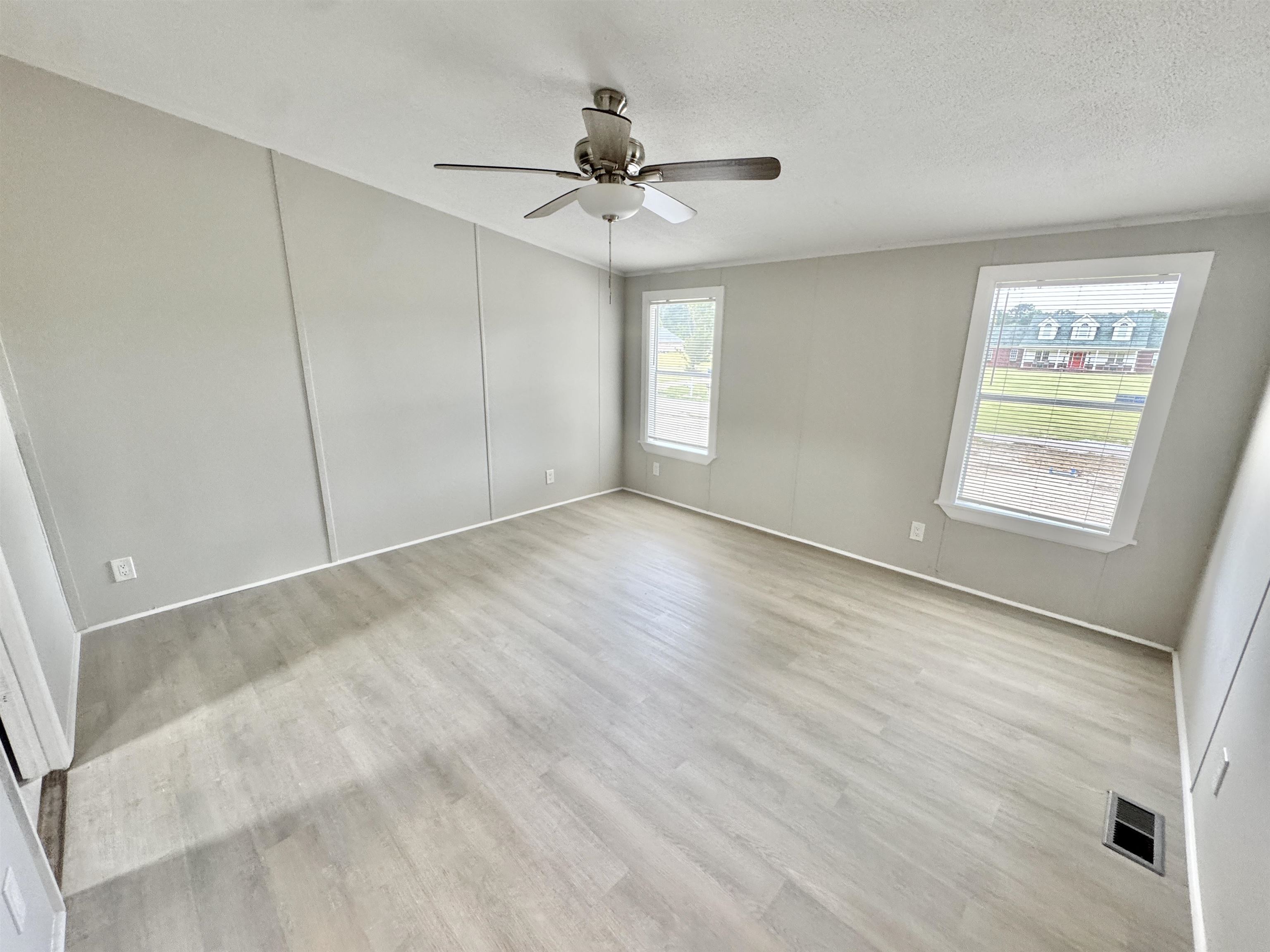 3178 Portersville Road Atoka, TN 38004 - Photo 14 of 31 wooden floor in an empty room with a window