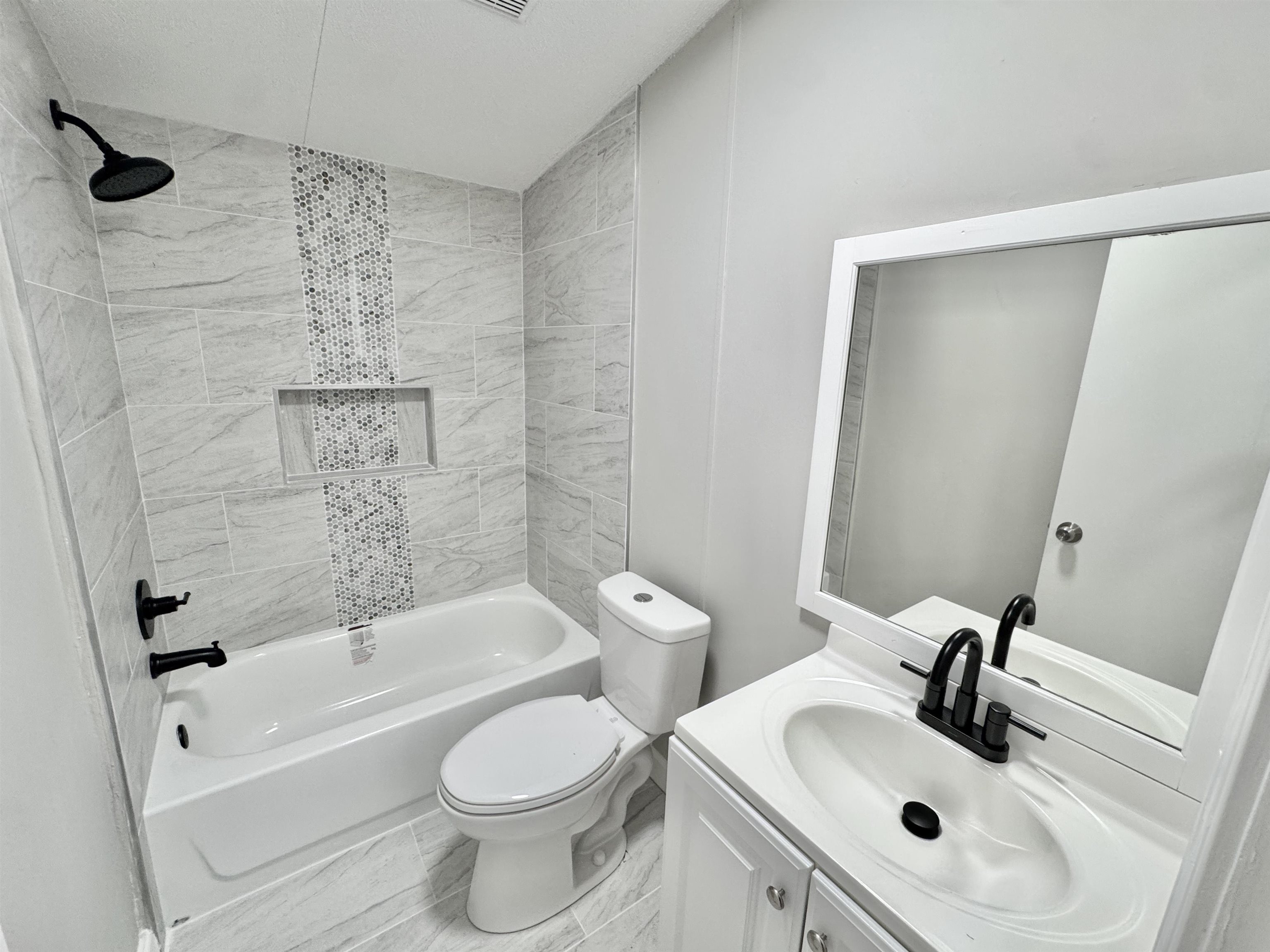 3178 Portersville Road Atoka, TN 38004 - Photo 16 of 31 a bathroom with a sink a toilet and shower