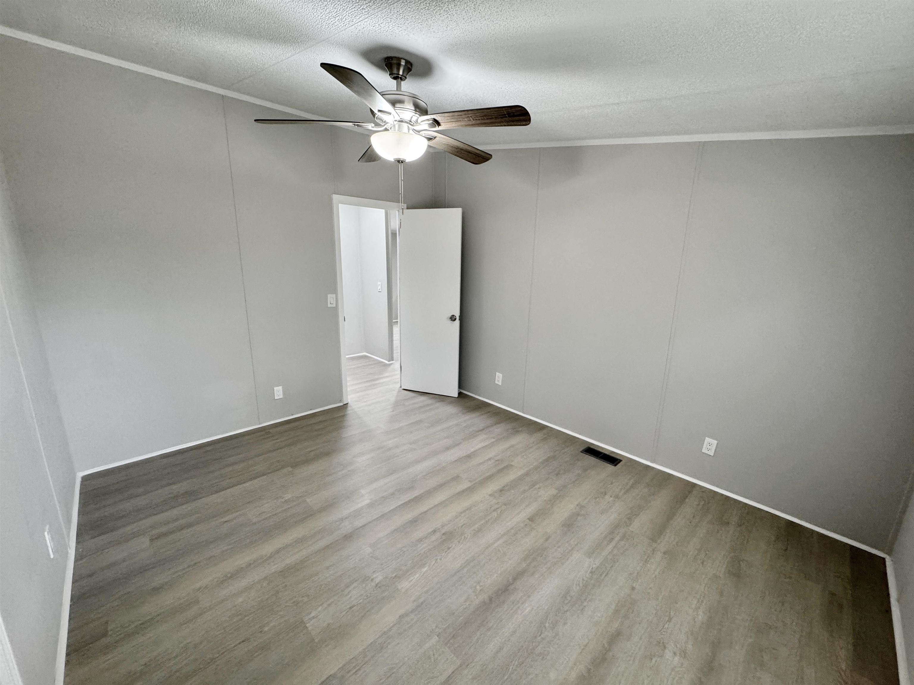 3178 Portersville Road Atoka, TN 38004 - Photo 18 of 31 wooden floor in an empty room
