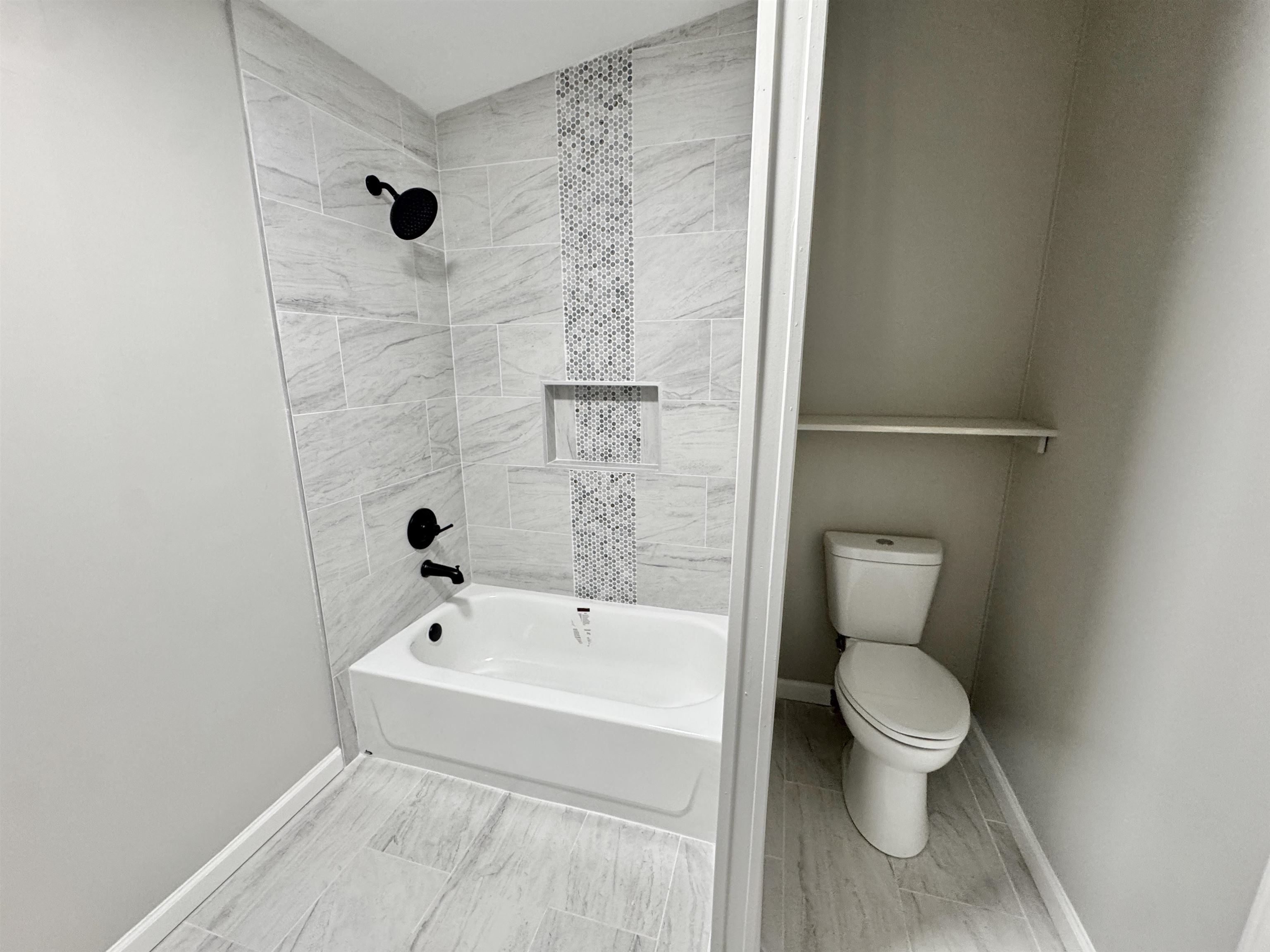 3178 Portersville Road Atoka, TN 38004 - Photo 23 of 31 a white toilet sitting next to a bathroom sink