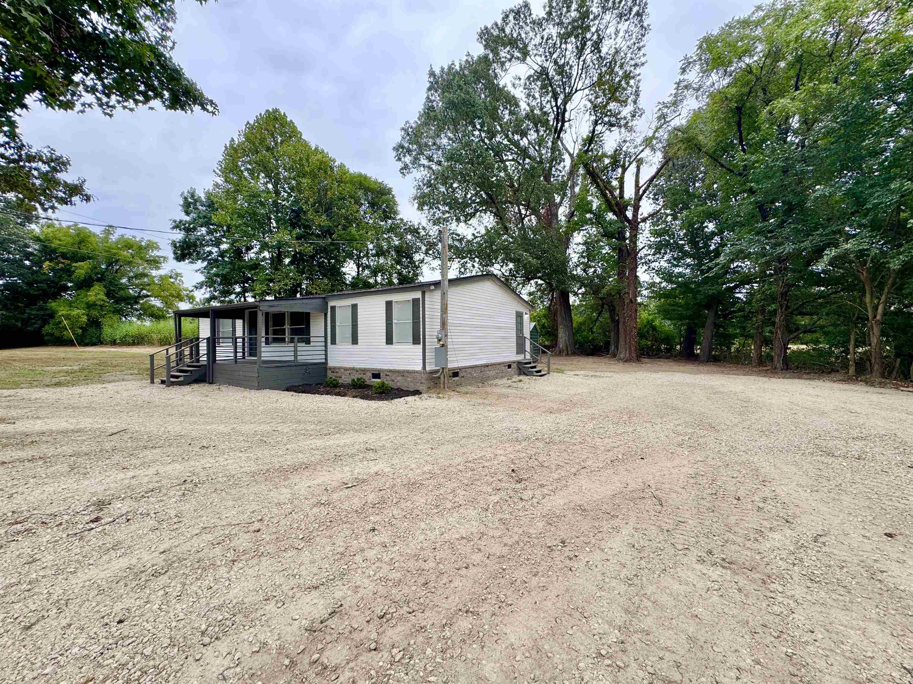 3178 Portersville Road Atoka, TN 38004 - Photo 28 of 31 a house with trees in the background