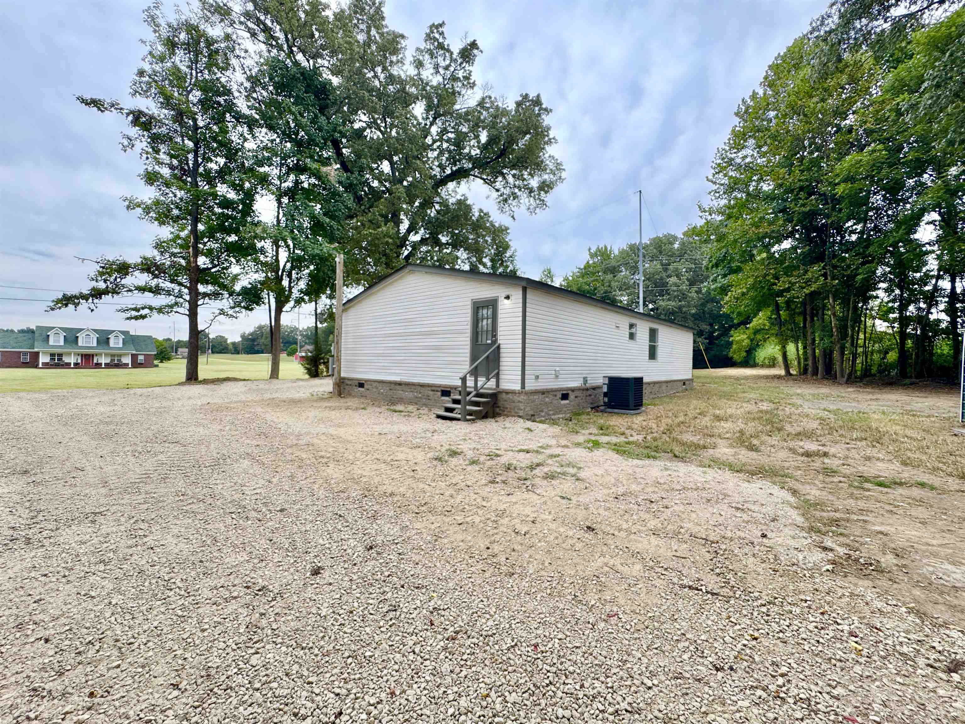 3178 Portersville Road Atoka, TN 38004 - Photo 29 of 31 a view of a house with a yard