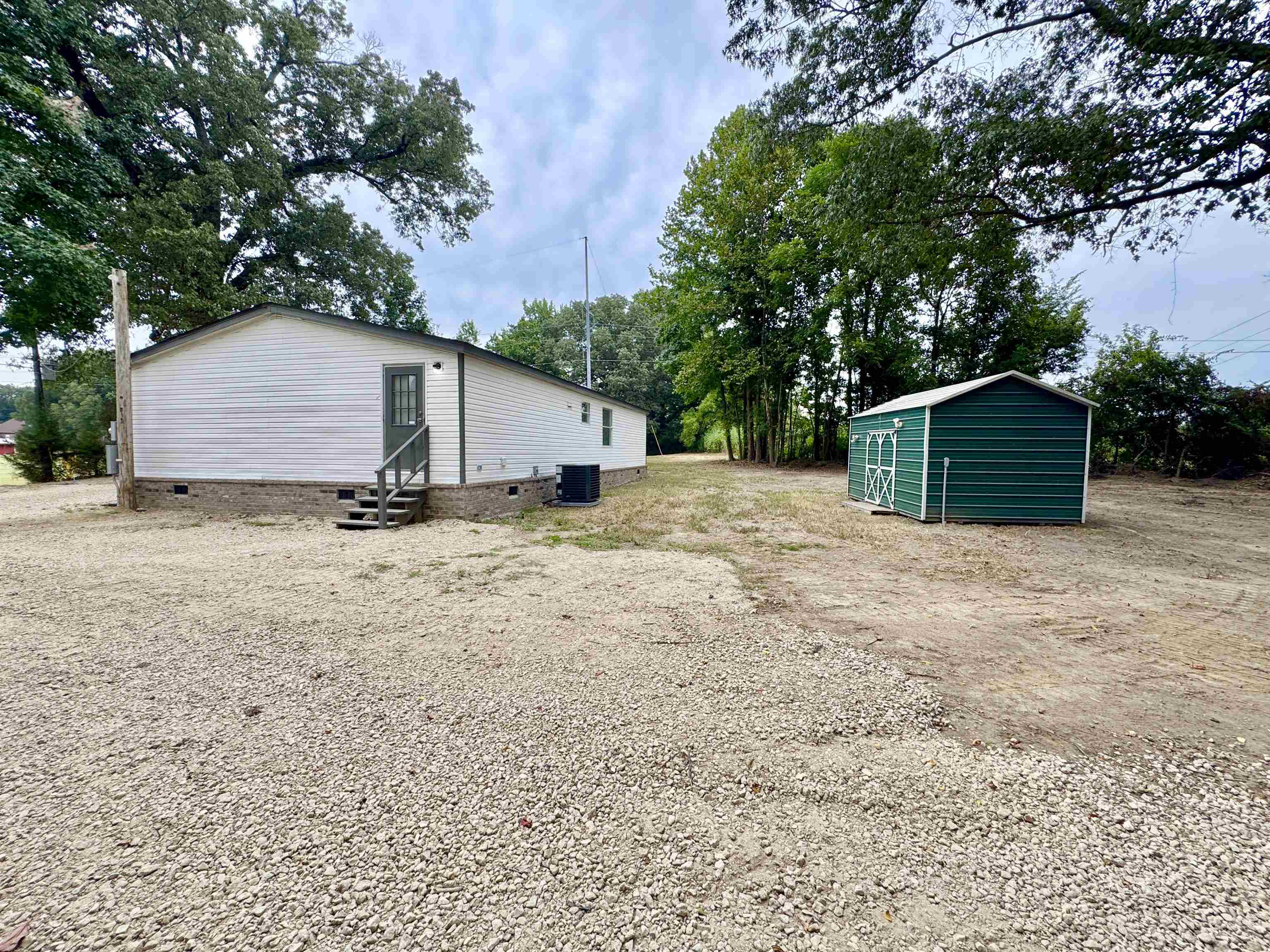 3178 Portersville Road Atoka, TN 38004 - Photo 3 of 31 a view of a house with a yard