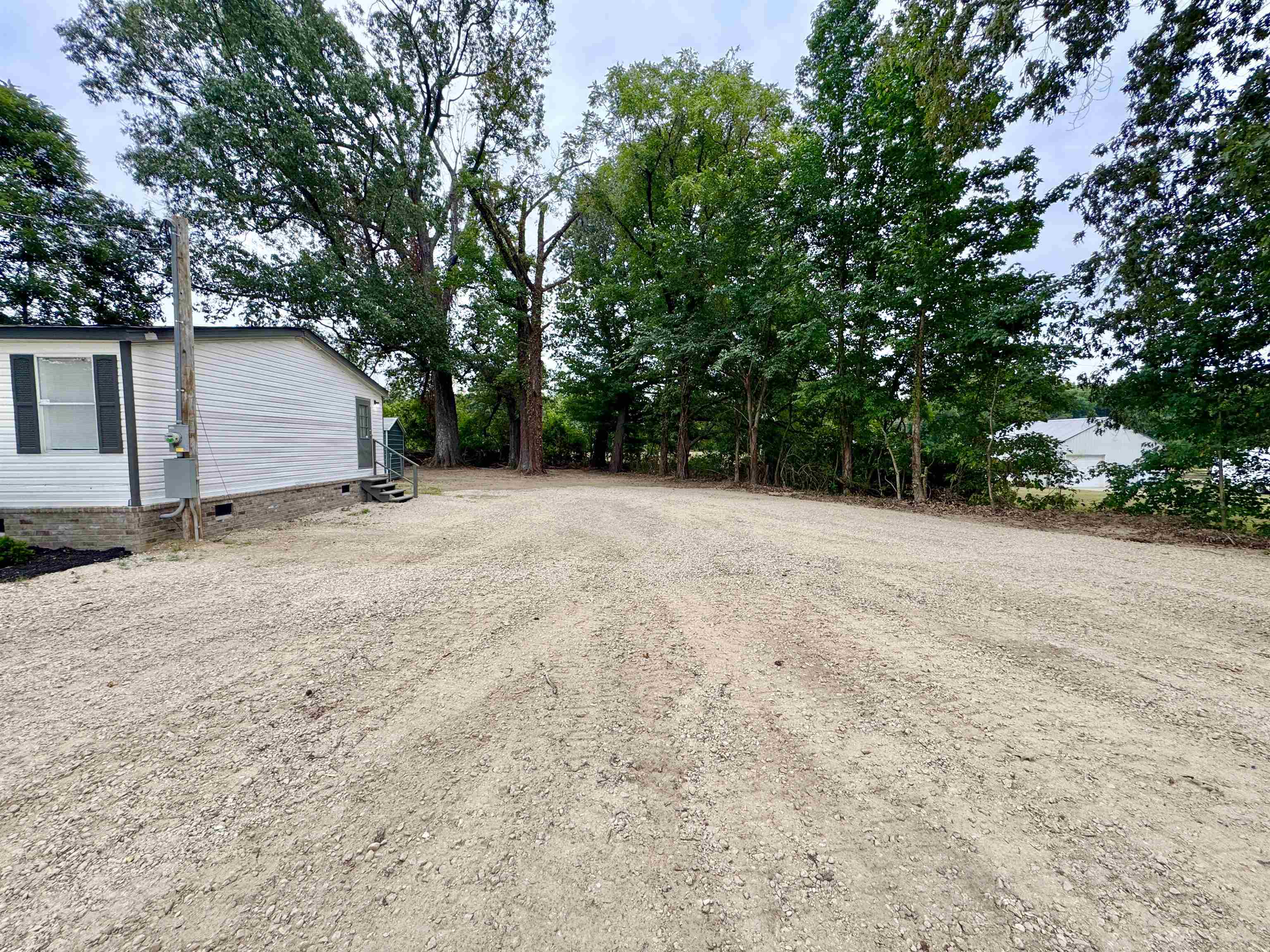 3178 Portersville Road Atoka, TN 38004 - Photo 31 of 31 a view of a house with a yard and garage